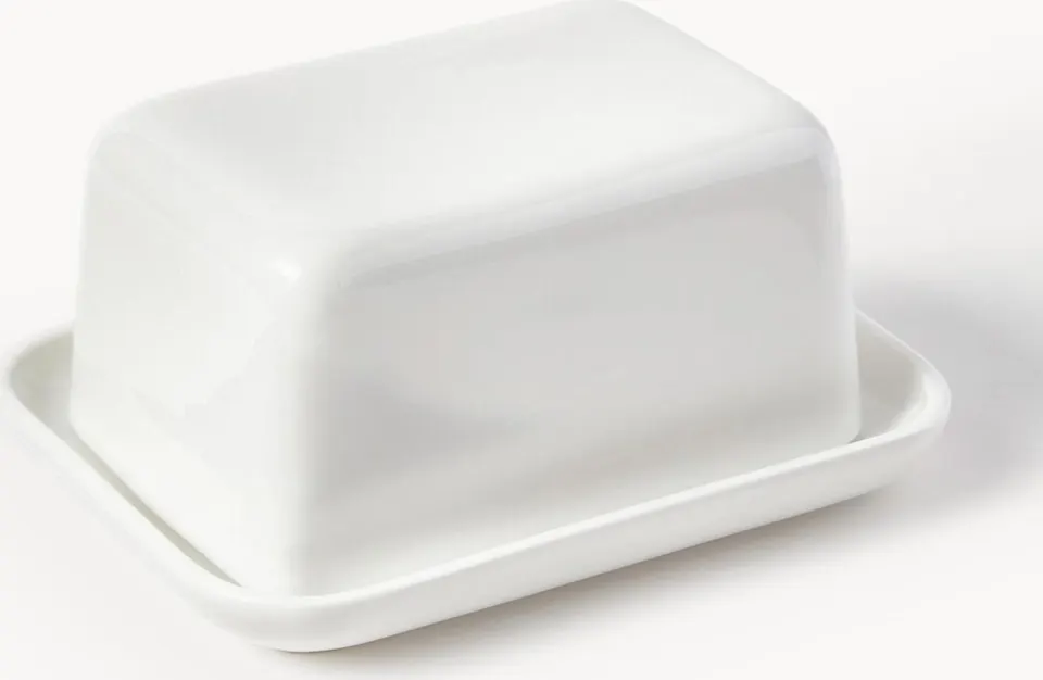 Elegante Porzellan-Butterdose mit Deckel, ideal zum stilvollen Servieren von Butter auf dem Tisch, hochwertiges Design und praktische Handhabung.